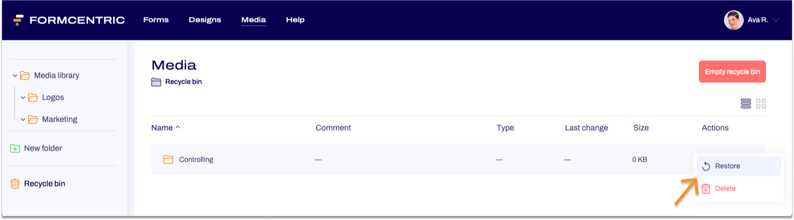 The recycle bin in the Media area is visible. A context menu is open. An arrow points to Restore.